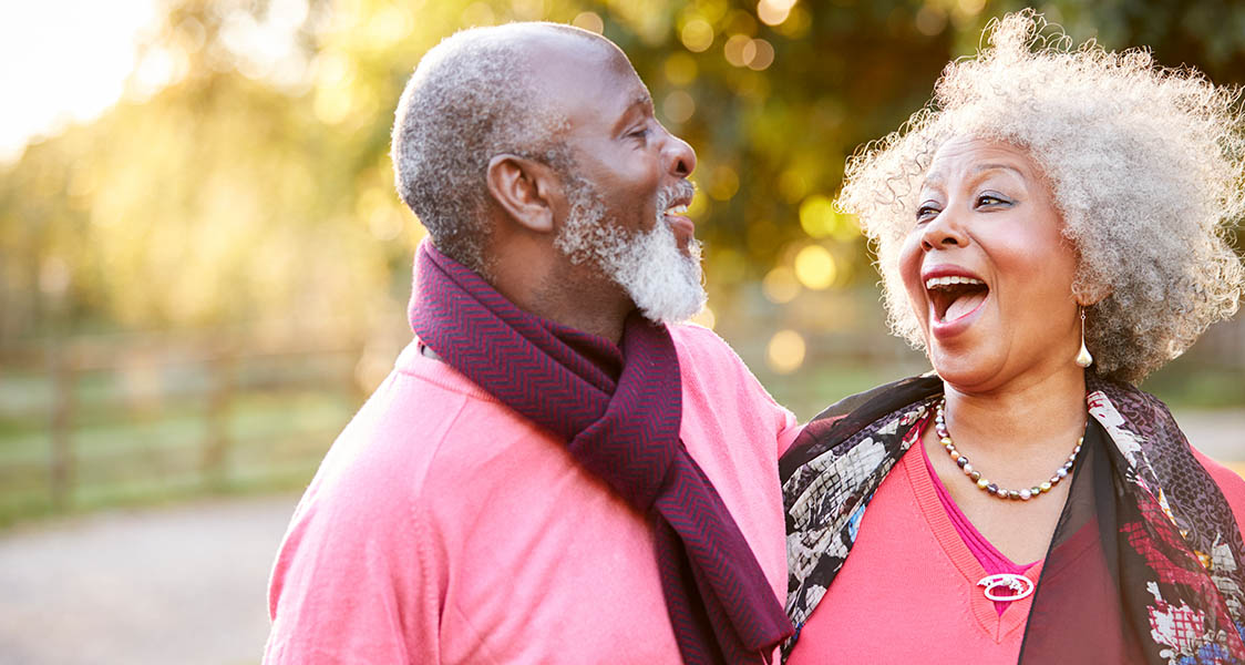 husband and wife smiling and laughing